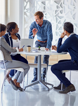 Office workspace with team reviewing reports